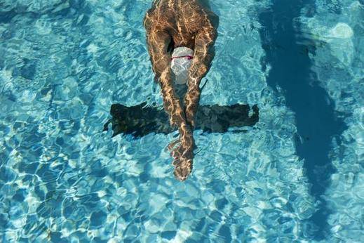 Why Athletes Wear Swimming Caps - And Why You Should Too!